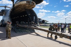 C-5 arrives unload the tow bar