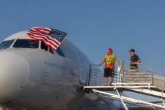 Honor-flight-Bob-gets-the-door-